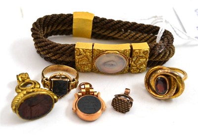 Lot 44 - A group of Victorian jewellery including; a bracelet of woven hair with an eye miniature, a...