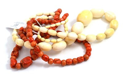 Lot 63 - A late 19th century ivory necklace, of graduated oval beads, length 80cm and a coral necklace...