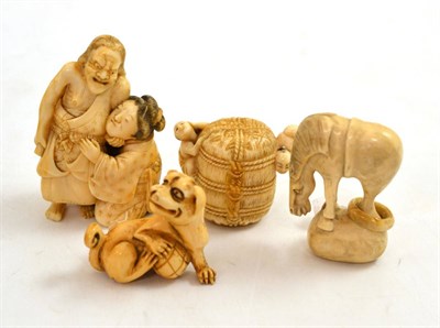 Lot 66 - A Japanese ivory erotic okimono, early 20th century, 7cm high and three similar netsukes