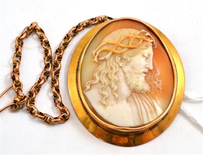 Lot 75 - A cameo brooch, the oval shell cameo carved with an image of Jesus wearing a crown of thorns,...