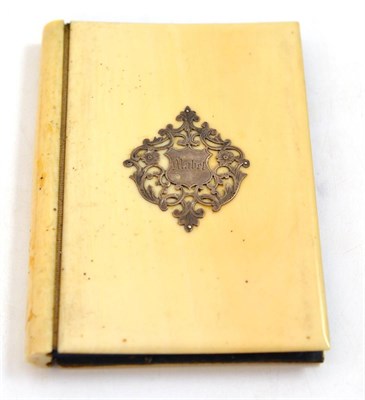 Lot 78 - An ivory bound aide memoire and pencil, late 19th century, applied with a white metal cartouche...