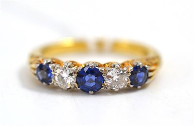 Lot 84 - A sapphire and diamond five stone ring, the round mixed cut sapphires alternate with round...