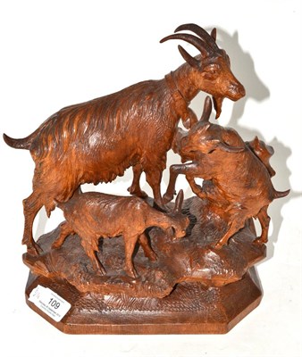 Lot 109 - A Swiss ";Black Forest"; carved wood group, late 19th/early 20th century, of an Ibex and her...