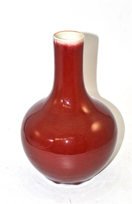 Lot 111 - A Chinese sang de boeuf glazed bottle vase, 31cm high