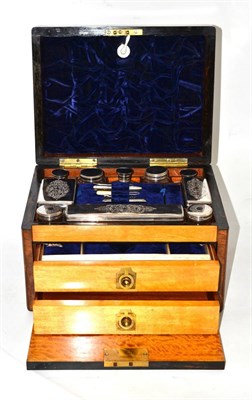 Lot 117 - A Victorian walnut dressing box with glass bottles and plated mounts