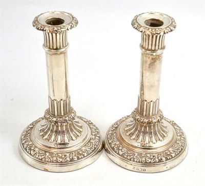 Lot 118 - A pair of George III silver candlesticks John & Thomas Settle, Sheffield 1816, the circular...