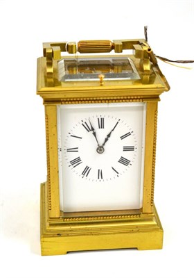 Lot 120 - A brass petite sonnerie and repeating carriage clock, circa 1900, carrying handle and repeat...