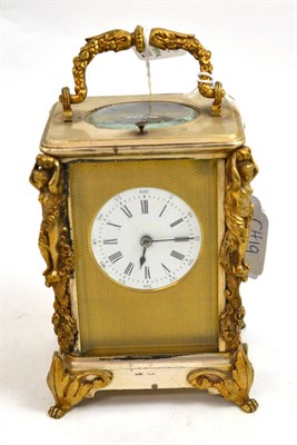 Lot 124 - A brass silvered figural striking and repeating carriage clock, circa 1880, cast floral and...