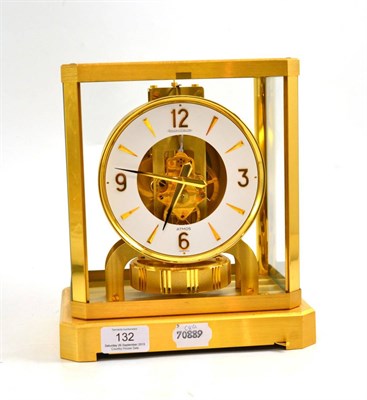 Lot 132 - An atmos clock, signed Jaeger LeCoultre, 20th century, white chapter ring with a skeletonised...