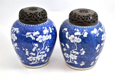 Lot 137 - A pair of Chinese ";Cracked Ice"; ground porcelain vases and wooden covers, one labelled for...