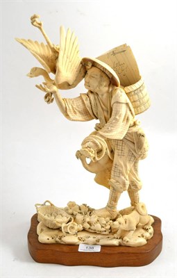 Lot 138 - A late 19th century large Japanese ivory okimono of a fisherman, with two cormorants, a basket...