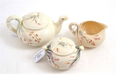 Lot 153 - A first period Belleek porcelain tea service, moulded and painted with crabstock handles,...