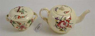 Lot 157 - A creamware teapot and cover of globular form painted with flower sprays, 19.5cm long; and an...