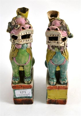 Lot 171 - A pair of Chinese porcelain spill vases, 19th century, modelled as Dogs of Fo, sitting on...