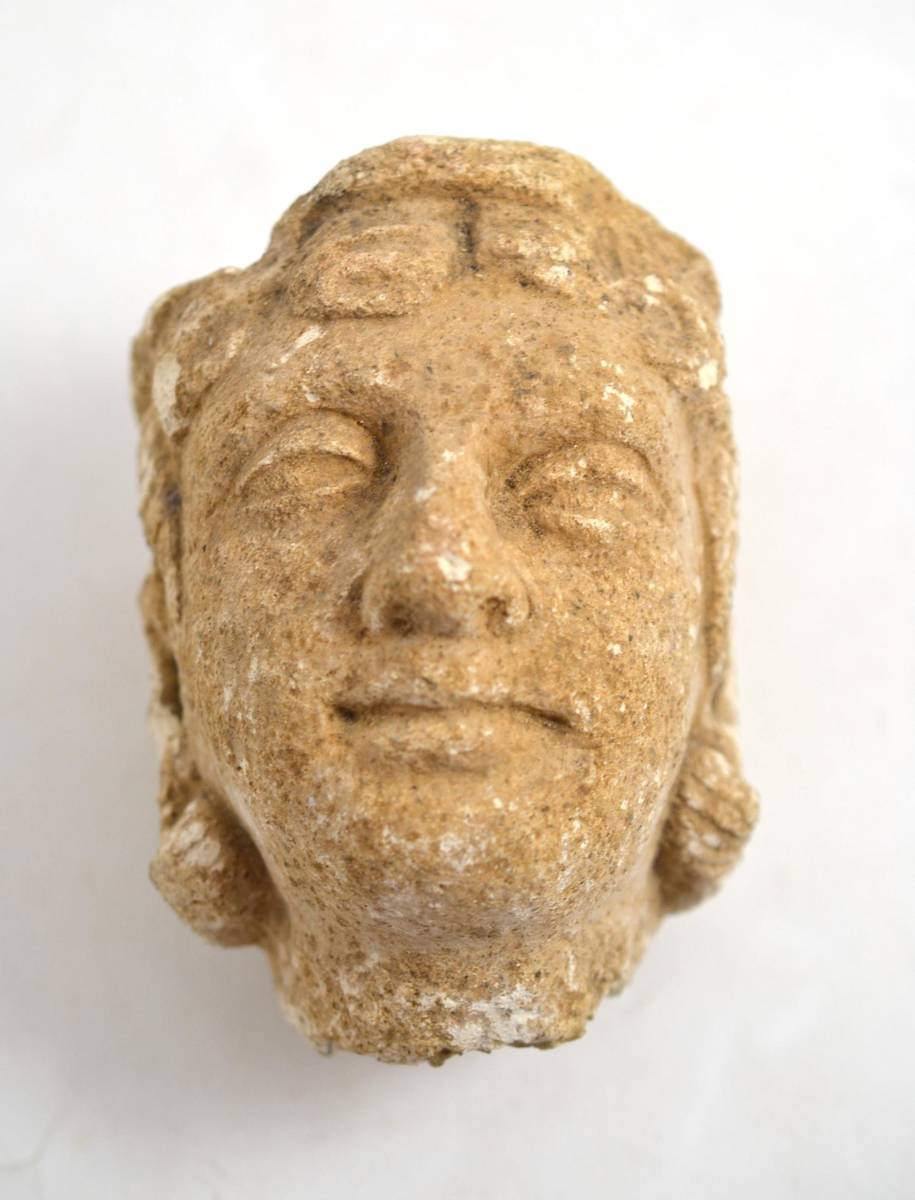 Lot 197 - A Medieval carved stone head