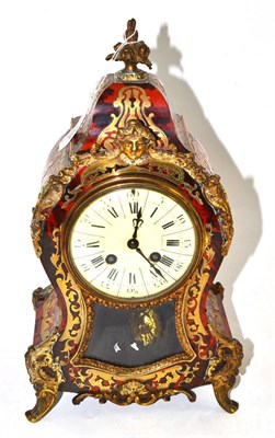 Lot 205 - A ";Boulle"; striking mantel clock, circa 1910, tortoiseshell and brass inlaid case with gilt metal