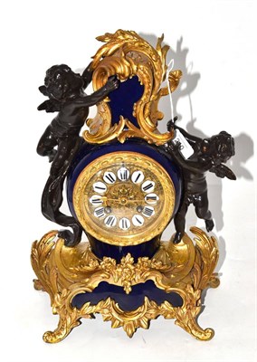 Lot 210 - A gilt metal and spelter striking mantel clock, circa 1900, Sevres style blue porcelain case...