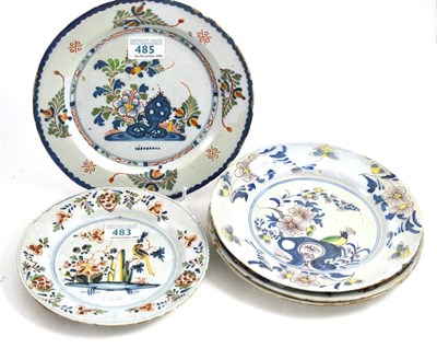 Lot 217 - An English Delft plate, with Ann Gomm style decoration, two similar plates painted with a...