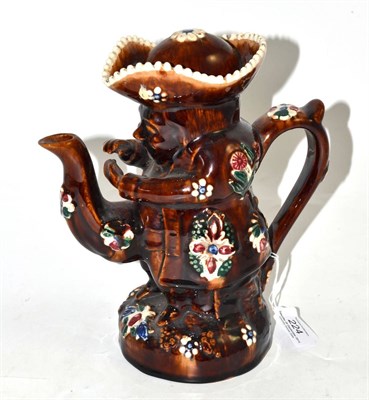 Lot 224 - Meashamware snuff taker Toby jug teapot and cover, circa 1880, typically decorated with...