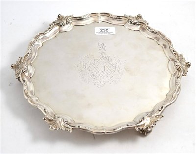 Lot 230 - A George II silver salver, Edward Wakelin , London 1753, shaped circular with a scroll border...