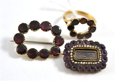 Lot 262 - A foil backed garnet brooch, measures 3.1cm by 2.4cm, a ring similar, finger size P and a...