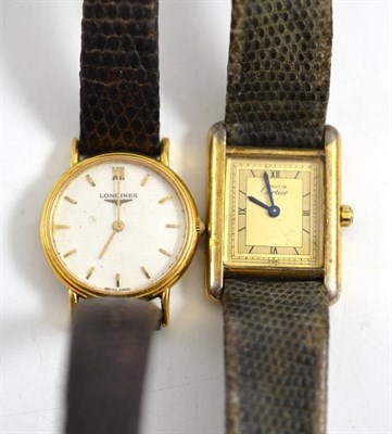 Lot 264 - A lady's 18ct gold wristwatch, signed Longines, quartz movement, textured dial with applied...