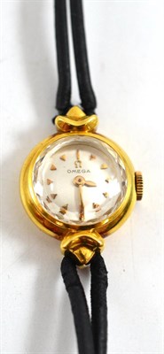 Lot 275 - A lady's 18ct gold wristwatch, signed Omega, circa 1960, lever movement, silvered dial, case...