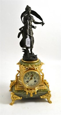 Lot 313 - A green onyx gilt metal striking mantel clock, circa 1910, figural case with applied gilt metal...