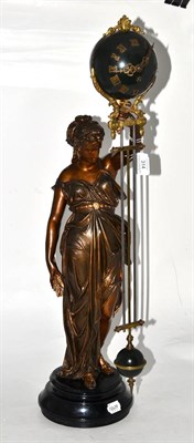 Lot 314 - A bronzed spelter mystery timepiece, early 20th century, case depicting a figure in costume holding