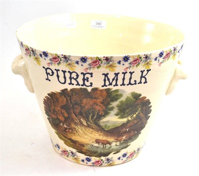 Lot 390 - A ceramic twin handled bowl with a transfer decorated landscape and titled ";Pure Milk";, 36cm...