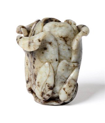 Lot 401 - A Chinese jade magnolia vase, Qing Dynasty, 18th/19th century, naturalistically modelled, the...