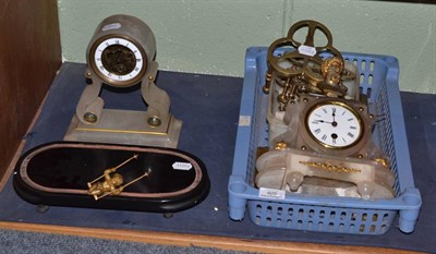 Lot 405 - Two onyx mantel timepieces and two clock movements