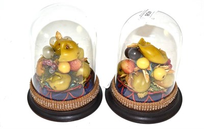 Lot 408 - A pair of Victorian wax fruit ornaments under domes