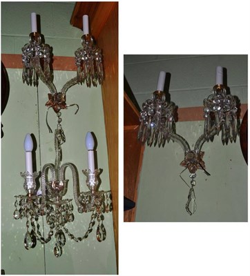 Lot 409 - A pair of cut glass two-branch wall lights with pear shaped drops and another two-branch wall light