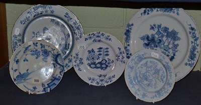 Lot 415 - An English Delft circular dish, painted in blue with a vase and flower, 36cm diameter; a...