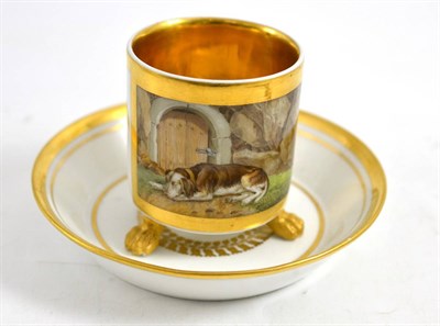 Lot 438 - A Continental coffee can and saucer painted, with a hound