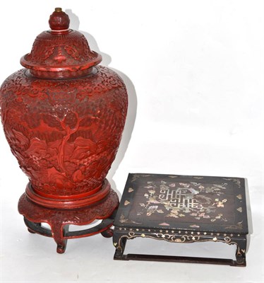 Lot 481 - Chinese late Qing dynasty cinnabar lacquer covered jar, on a stand and an inlaid hardwood and...