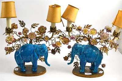 Lot 482 - Pair of floral candelabra in metal and porcelain, mounted with turquoise ceramic elephants