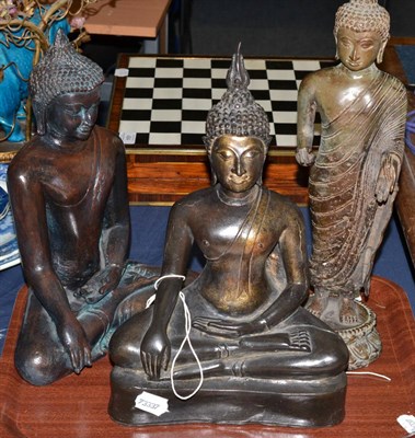 Lot 485 - An Indian bronze figure of a standing Buddha, 40cm high; and two reproduction resin figures...