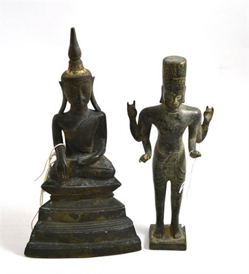 Lot 486 - An Indian bronze figure of a seated Buddha raised on a stepped platform base, 29cm high; and a...