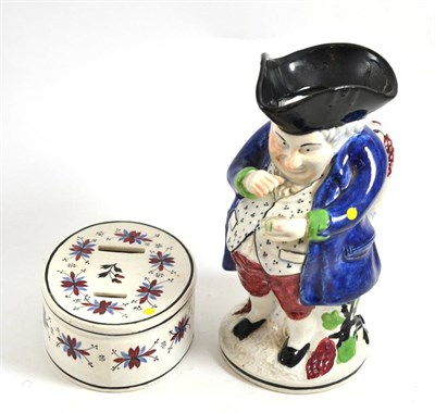 Lot 500 - * A Yorkshire Toby jug, 23cm high (a.f.) and a 19th century floral decorated oval money box,...