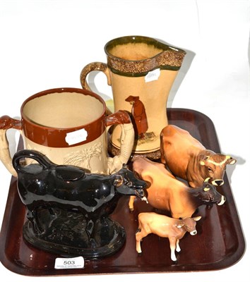 Lot 503 - * A Royal Doulton night watchman jug, 17.5cm high, a stoneware loving cup, a Victorian cow creamer