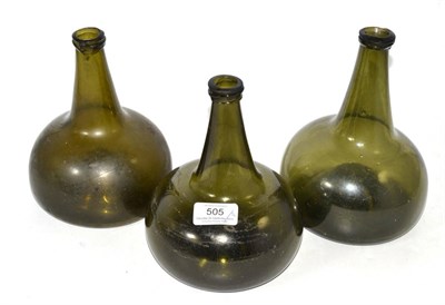 Lot 505 - Three 18th century green glass onion bottles, two at 18cm high, one 19cm high