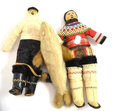 Lot 521 - Three figures modelled as two Eskimos and a seal