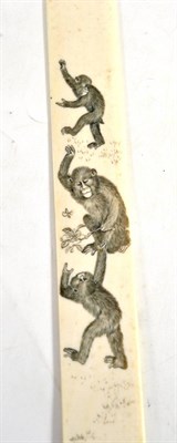 Lot 530 - A Japanese ivory page turner, late 19th century, decorated with three monkeys, 36cm long