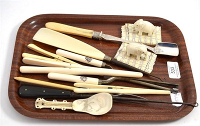 Lot 533 - A small collection of late Victorian/Edwardian ivory items including an Inuit bone spoon, pair...