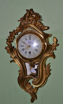 Lot 549 - An ormolu cartel wall timepiece with pull quarter repeat, early 20th century, scroll and floral...