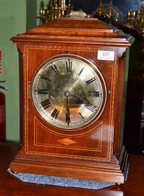 Lot 577 - An inlaid chiming table clock, circa 1910, carrying handle, boxwood inlaid stringing,...