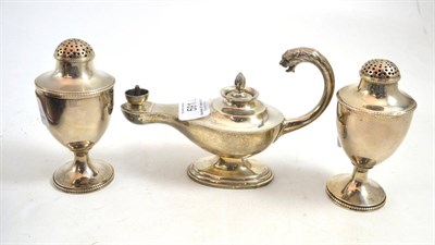 Lot 591 - A pair of silver pepperettes and a silver genie lamp