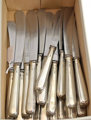 Lot 593 - A set of twelve George V silver handled dinner knives, Thomas Bradbury & Sons Ltd, Sheffield...